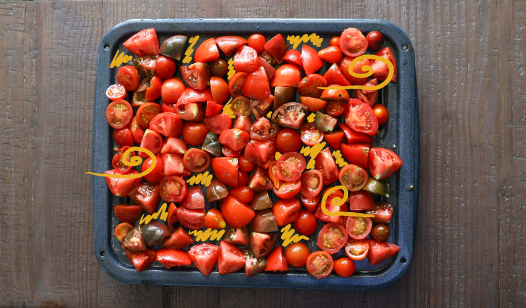 tomatoes laid out on pan before roasting