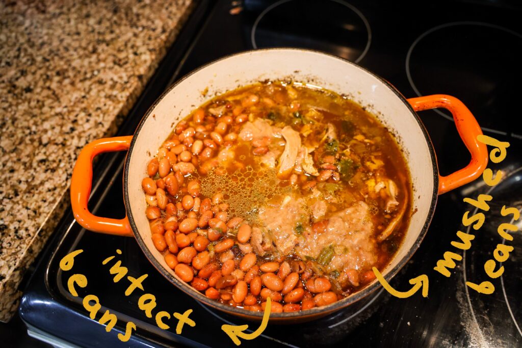 put both mashed and intact beans in pot