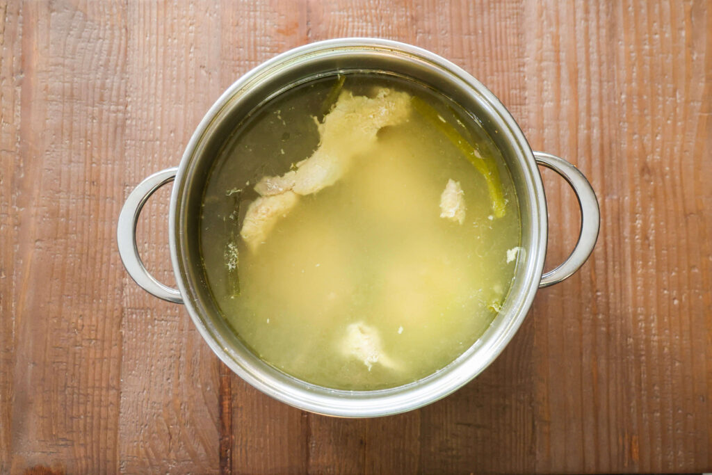 cooked chinese chicken stock before straining