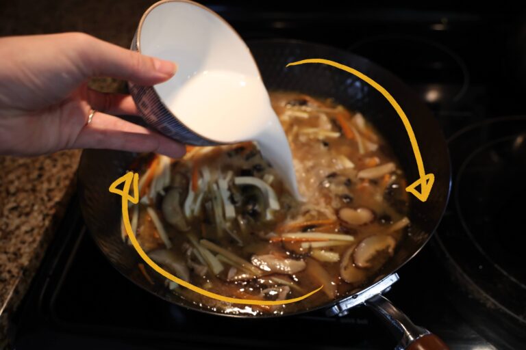 pour cornstarch into wok