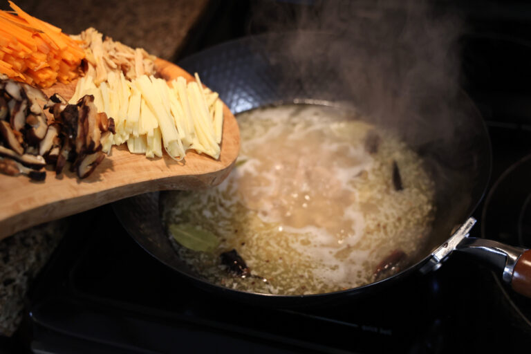 pour other julienned ingredients into wok