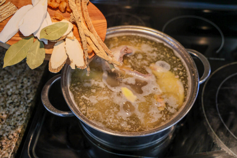 adding all herbs to soup