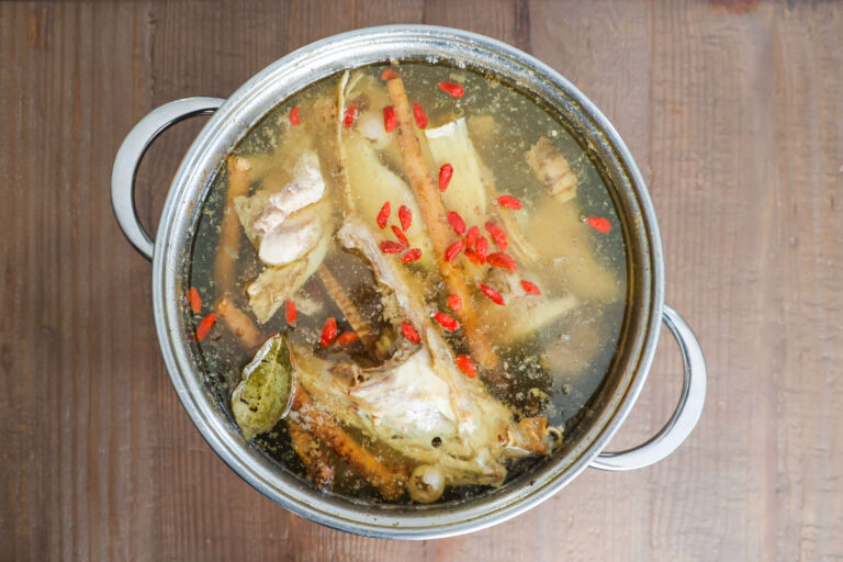 chinese herbal soup with chicken and pork neck bones done cooking